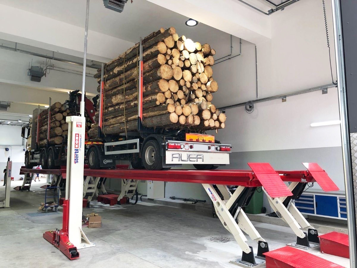 A fully-loaded logging truck on a SKYLIFT